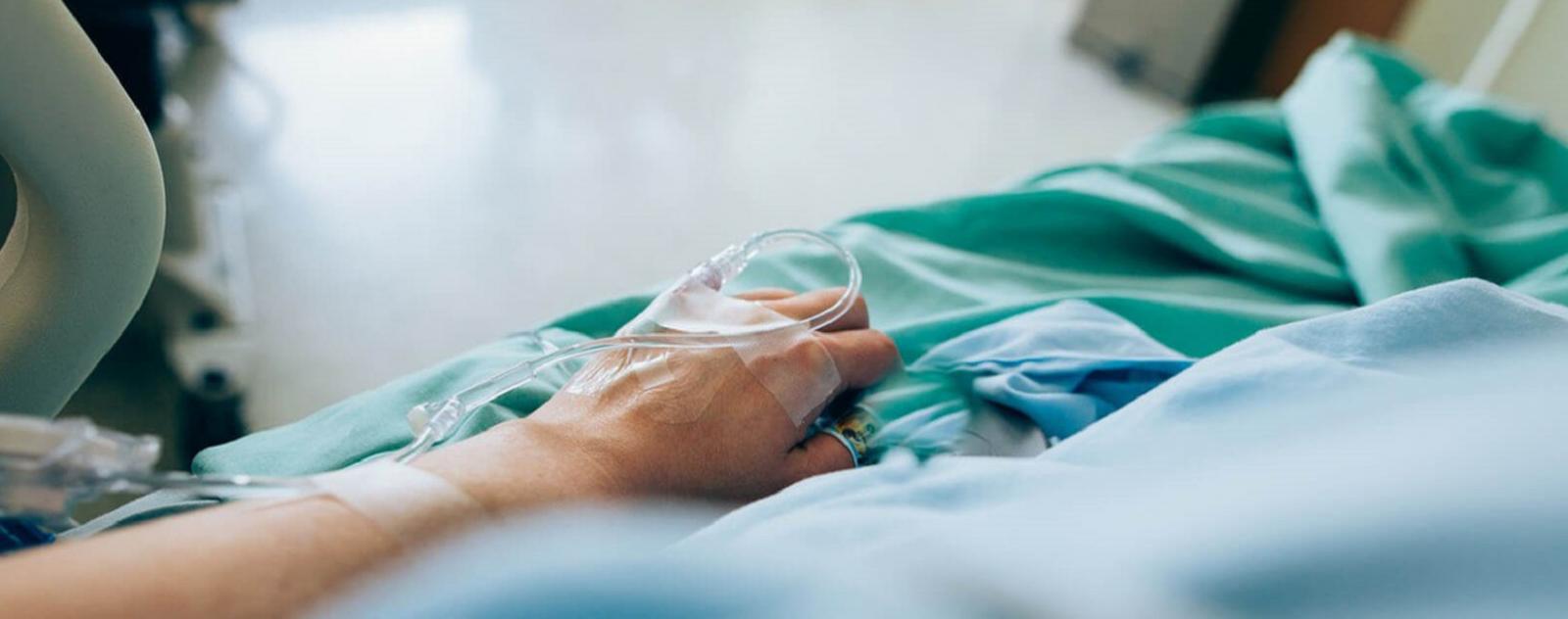 patient-lying-medical-bed-iv-catheter.jpg